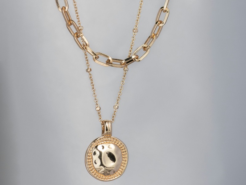 Layered gold chain necklaces with a hammered pendant, fine jewelry at our Greensboro store