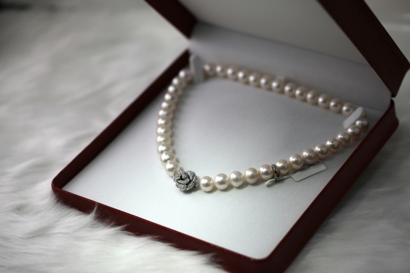Pearl necklace with a diamond clasp in a gift box at our Greensboro jewelry store