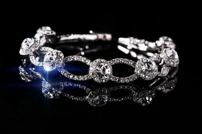 Diamond and white gold bracelet photographed on black