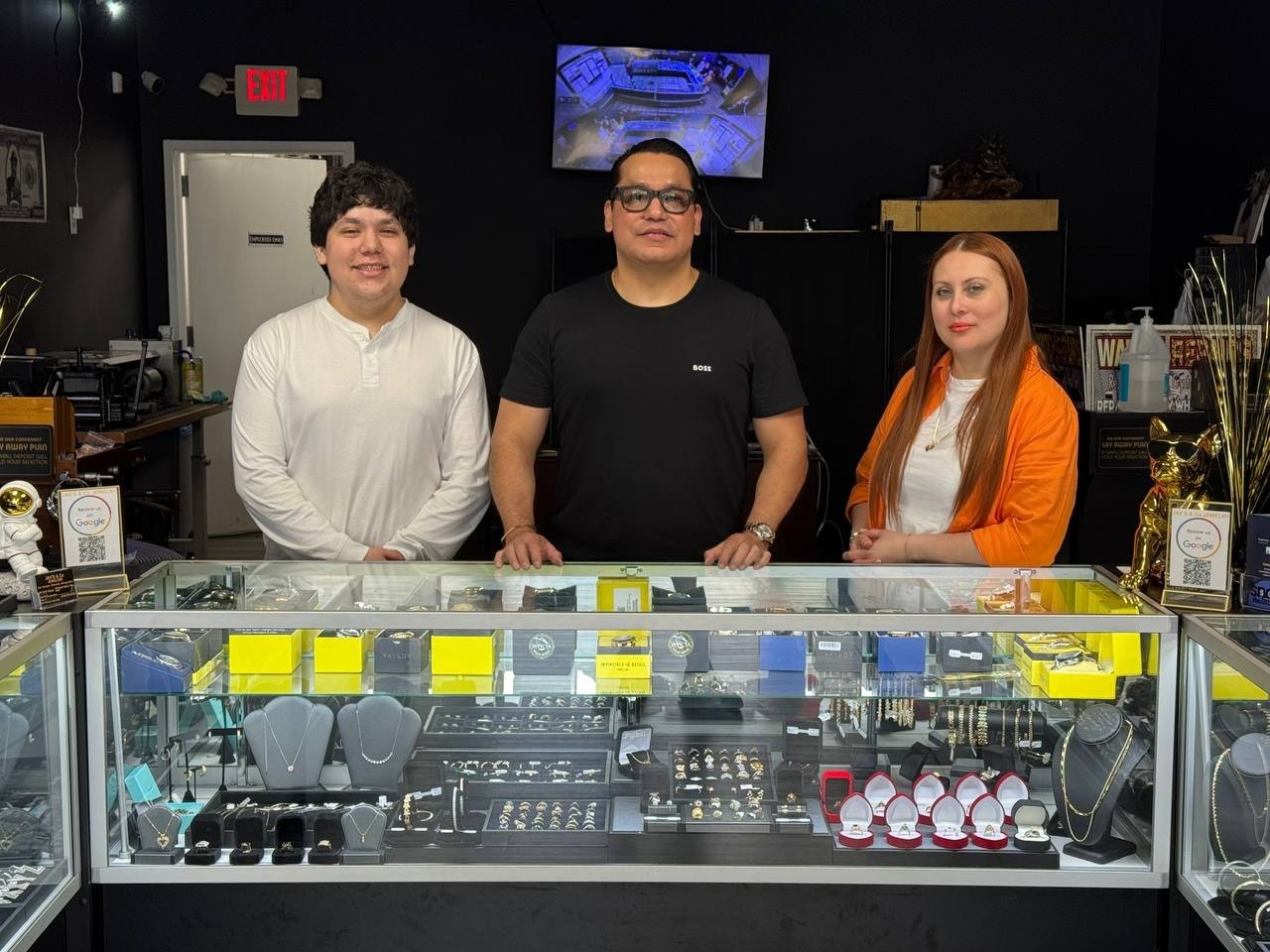 The Jav's & Co Jewelry team behind the display counter at our Greensboro store